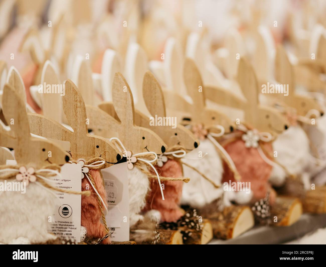 Wooden plywood rabbits in the form of gift figurines on the eve of Catholic Easter in one of the