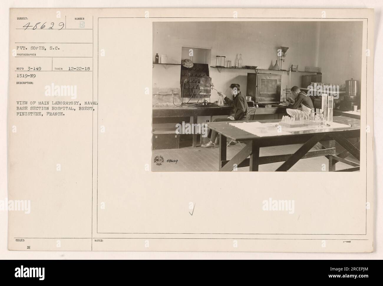 Image of the main laboratory at the Naval Base Section Hospital in Brest, Finistere, France. The photograph was taken by SC Photographer Reco on 12-22-18. The picture features Private Soper, ID number 48629, working in the lab. E MP4 notes that there were 21 takes of this image. Stock Photo