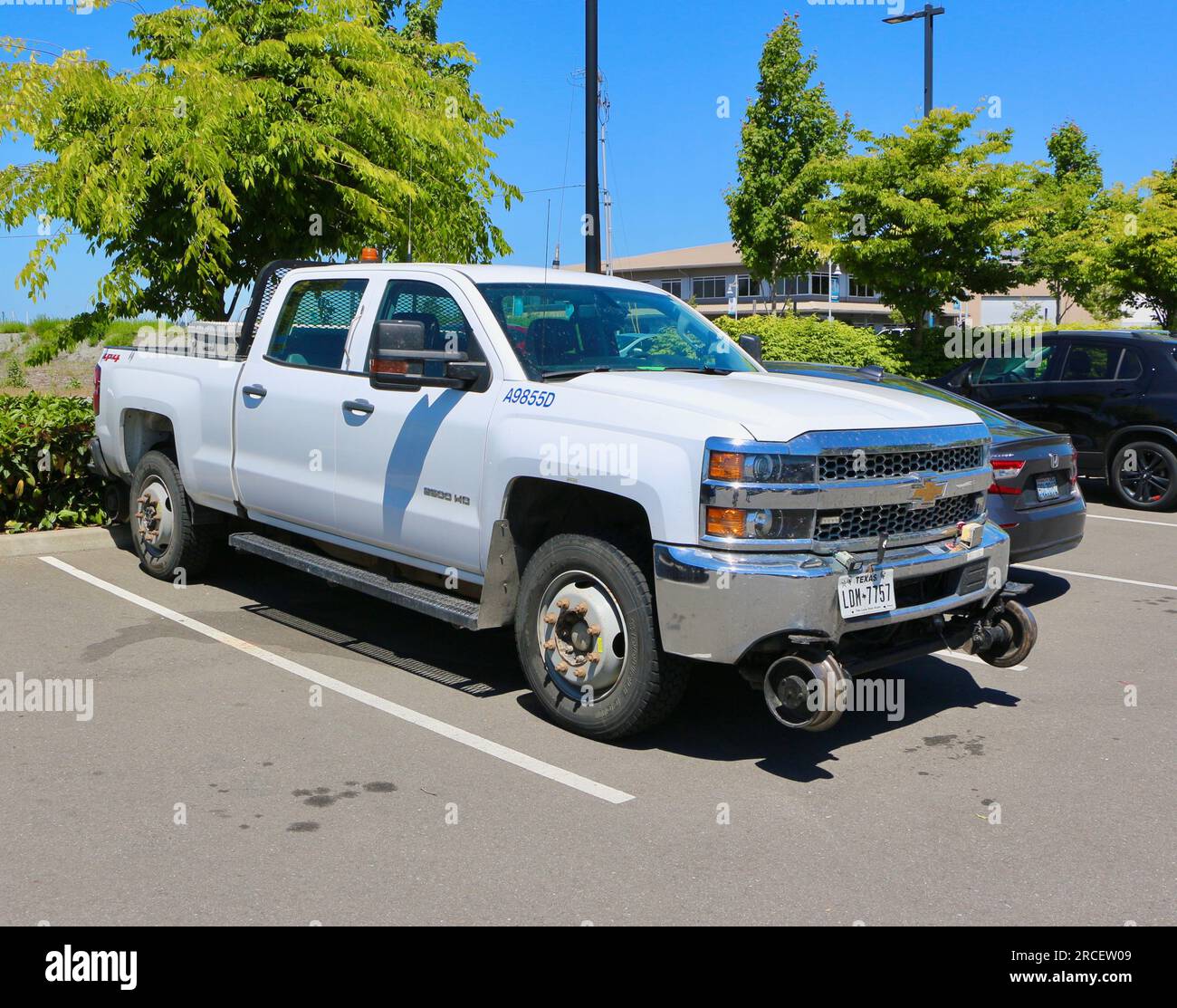 Chevrolet Silverado dual mode pickup truck fitted with light duty rail gear to travel on railway lines for maintenance Seattle Washington State USA Stock Photo