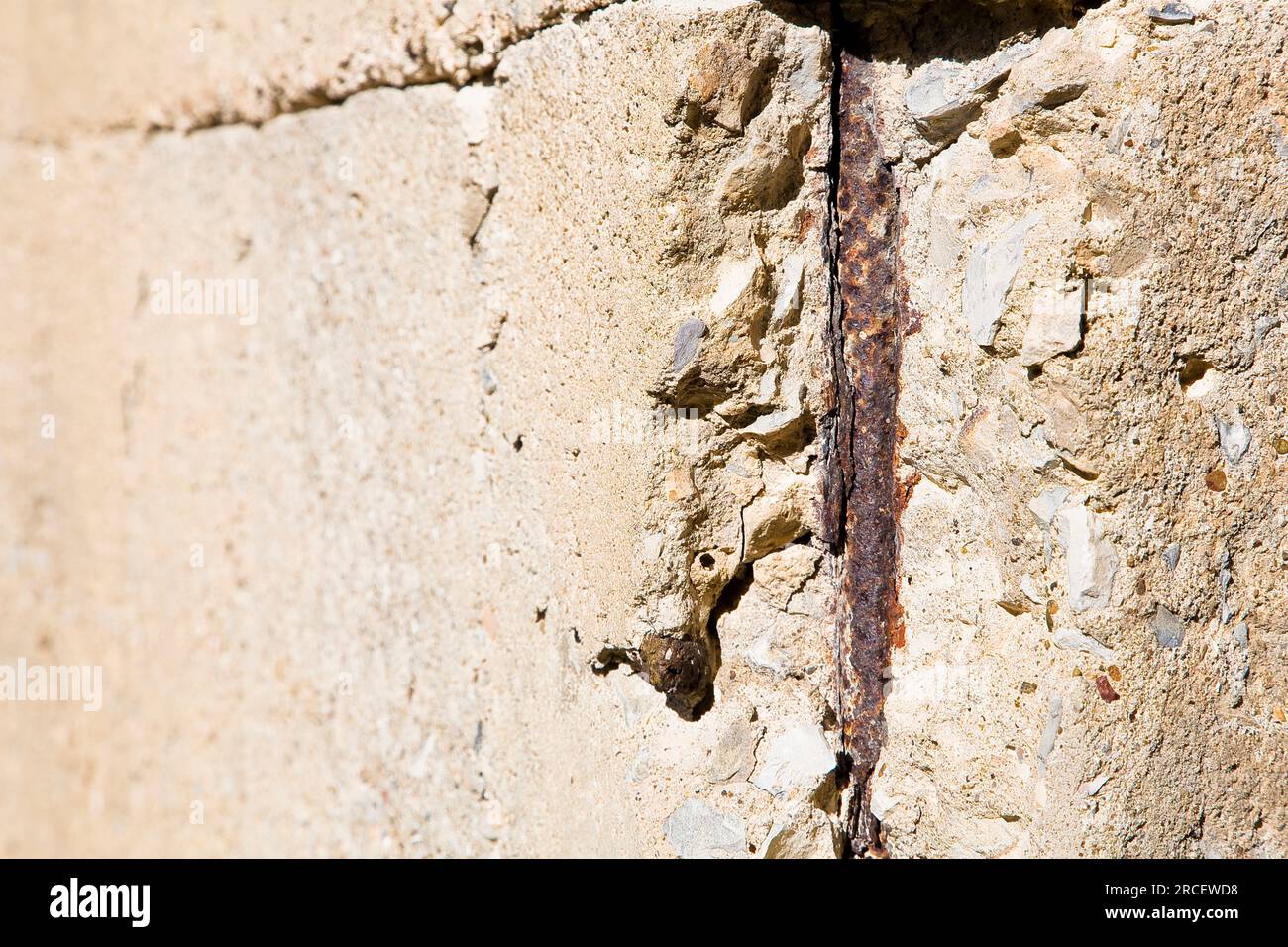 Old reinforced concrete structure with damaged and rusty metallic
