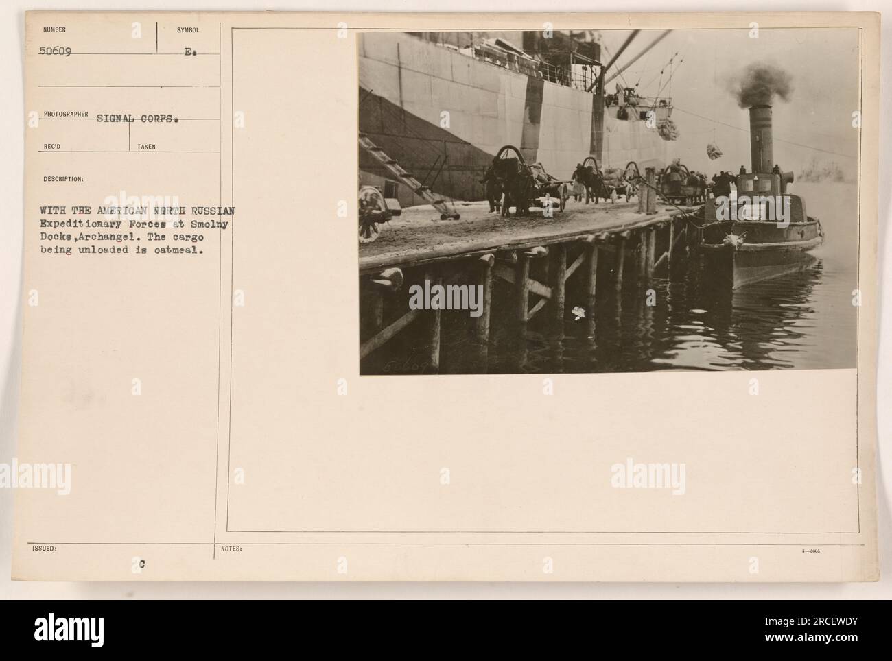 American troops unloading oatmeal at Smolny Docks in Archangel during ...