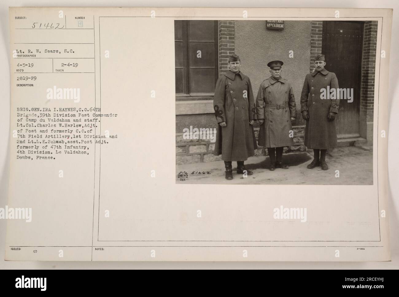 Brig. Gen. Ira I. Haynes, C.O. of the 64th Brigade, 39th Division, is seen with his staff at Camp du Valdahon. Also featured in the image are Lt. Col. Charles W. Harlow, Adjutant of the Post and former commander of the 7th Field Artillery, 1st Division, and 2nd Lt. L.E. Schwab, assistant Post Adjutant and former member of the 47th Infantry, 4th Division. The photo was taken on April 5, 1919, at Le Valdahon, Doubs, France. Stock Photo