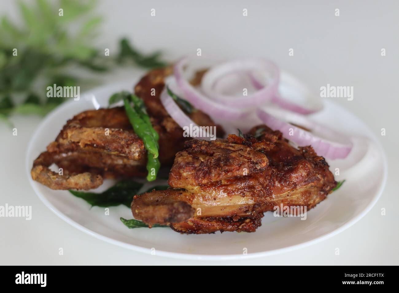 Kada fry or Quail fry. Deep fried quail meat marinated with red chili