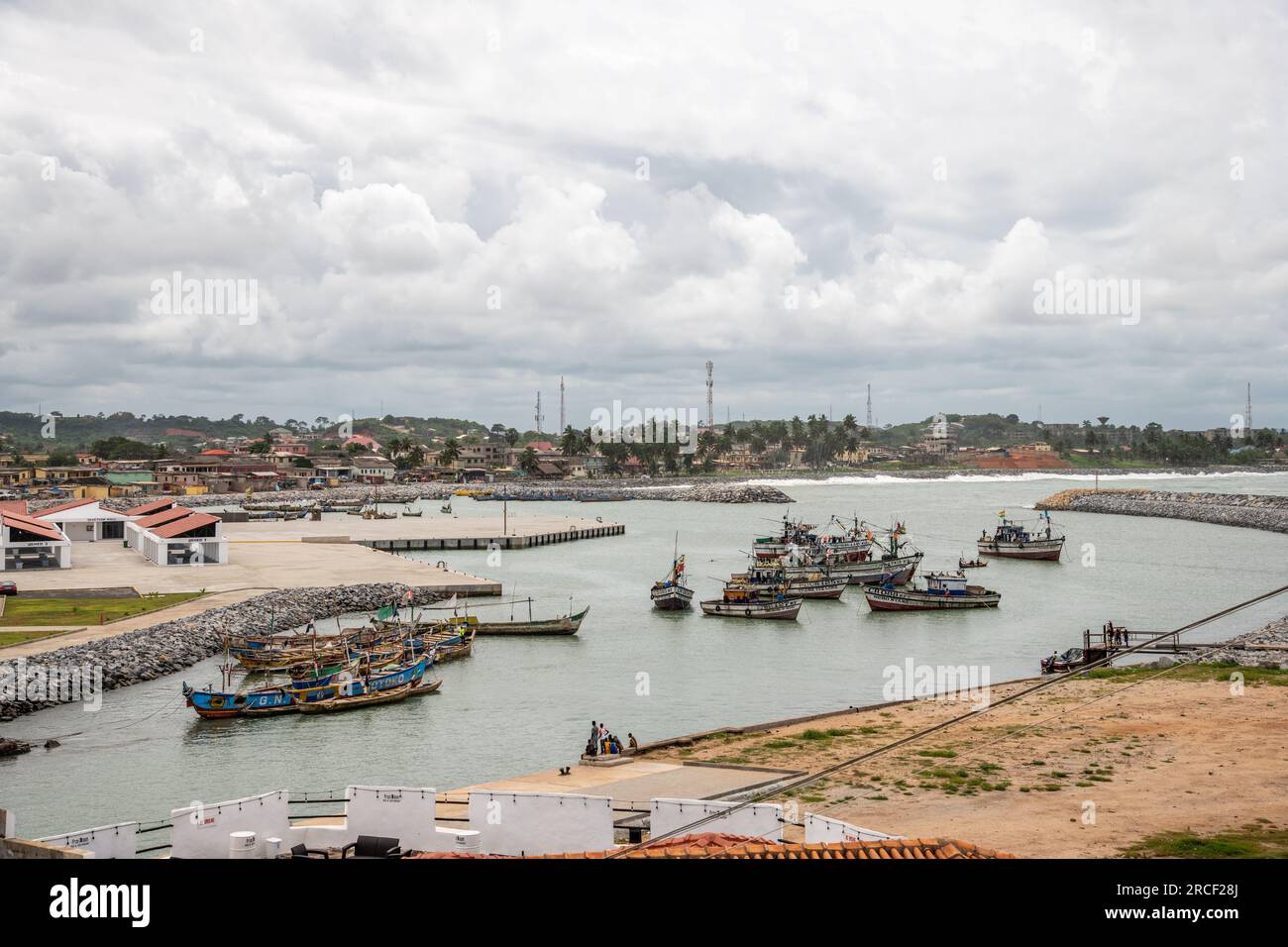 traditional wooden fishing boats in the harbor at Elmina, Ghana Stock Photo