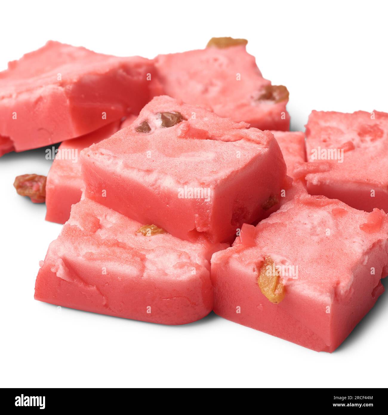 cubes of jelly pudding, close-up of delicious sweet dish made with fresh cream, condensed milk and strawberry jelly and spread prune isolated on white Stock Photo