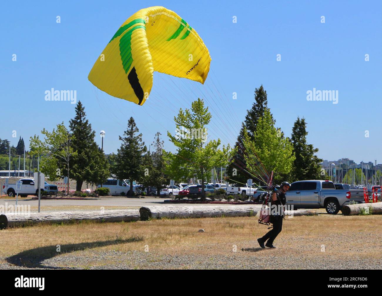 Series of images of a Powered paraglider launching from near the