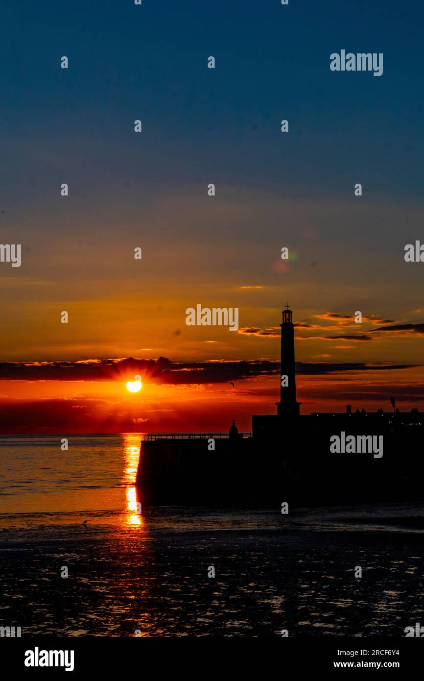 Scenic landscape photo of the sunset by the sea Stock Photo - Alamy