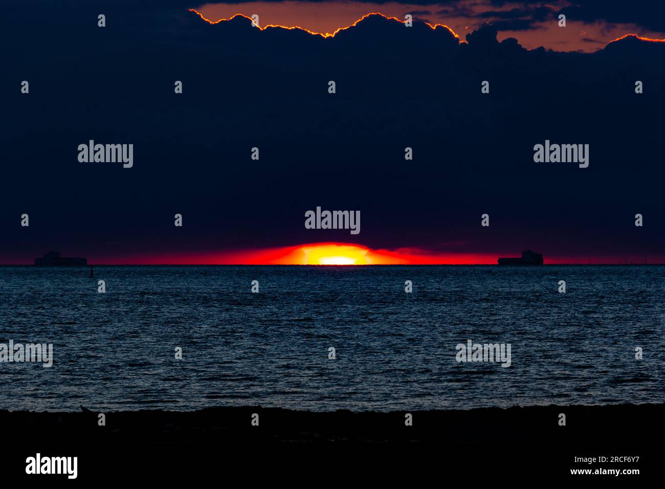 Scenic landscape photo of the sunset by the sea Stock Photo - Alamy