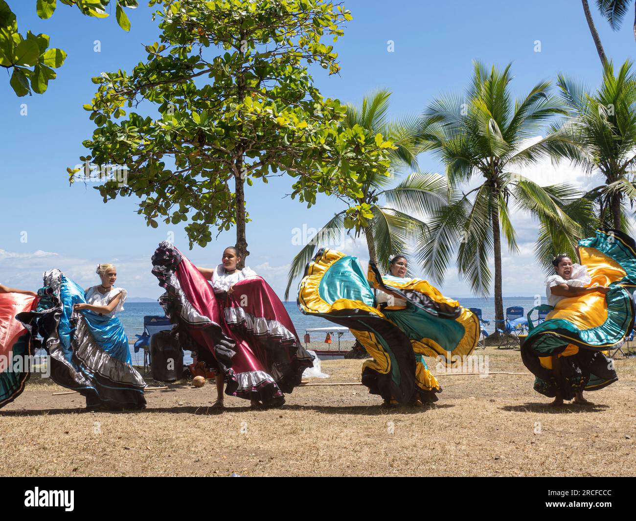 A group of young Costa Rican dancers in traditional dress perform at Playa Blanca, El Golfito, Costa Rica. Stock Photo