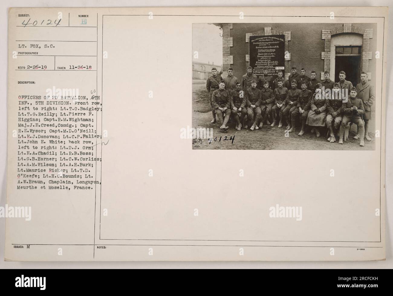 Officers of the 2nd Battalion, TH Infantry, 5th Division. Front row (L-R): Lt. T.O. Badgley, Lt. T.G. Reilly, Lt. Pierre F. Higgins, Capt. R.M. Wightman, Maj. J.E. Creed, Capt. R.E. Wysor, Capt. M.D. O'Neill, Lt. E.J. Donovan, Lt. C.P. Paller, Lt. John E. White. Back row (L-R): Lt. D.J. Orn, Lt. E.A. Chadil, Lt. R.B. Bos8, Lt. G.B. Horner, Lt. C.W. Corliss, Lt. A.M. Wilson, Lt. A.H. Burk, Lt. Maurice Ricker, Lt. T.D. O'Keefe, Lt. H.C. Bounds, Lt. A.W. Braun (Chaplain). Location: Longuyon, Meurthe et Moselle, France. Stock Photo