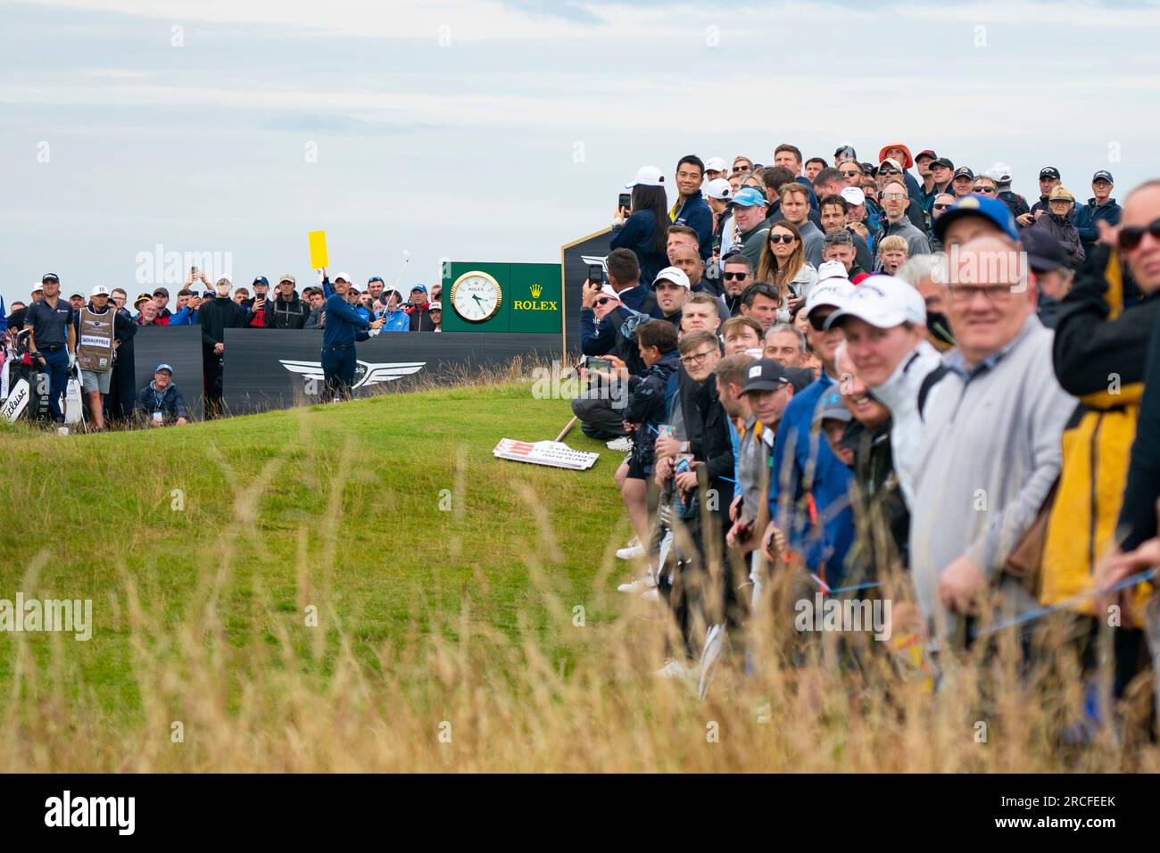 North Berwick, East Lothian, Scotland, UK. 14th July 2023. Rory McIlroy Tess off on the 9th hole with spectators following his ball flight at the Genesis Scottish Open at the Renaissance Club in North Berwick.  Iain Masterton/Alamy Live News Stock Photo