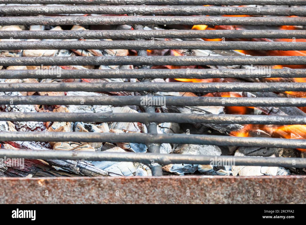 Empty hot charcoal barbecue BBQ grill with burning fire with flame and