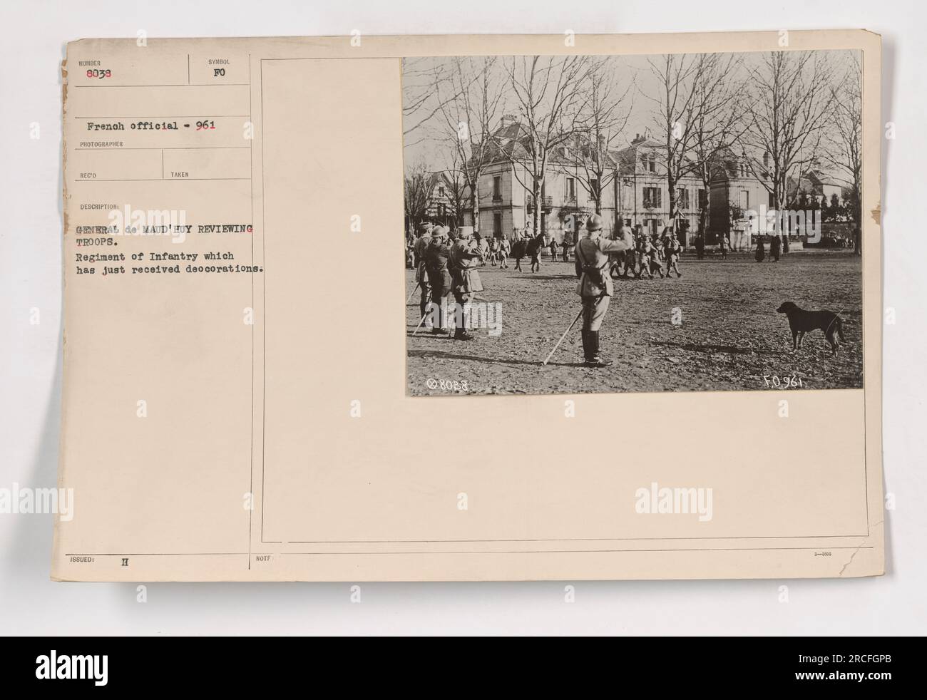 French General de Maud'Huy reviewing troops in a military ceremony. The photo shows the 1st Regiment of Infantry, recently decorated, in formation. Taken during World War One by photographer Reed, this image captures the official moment. Stock Photo