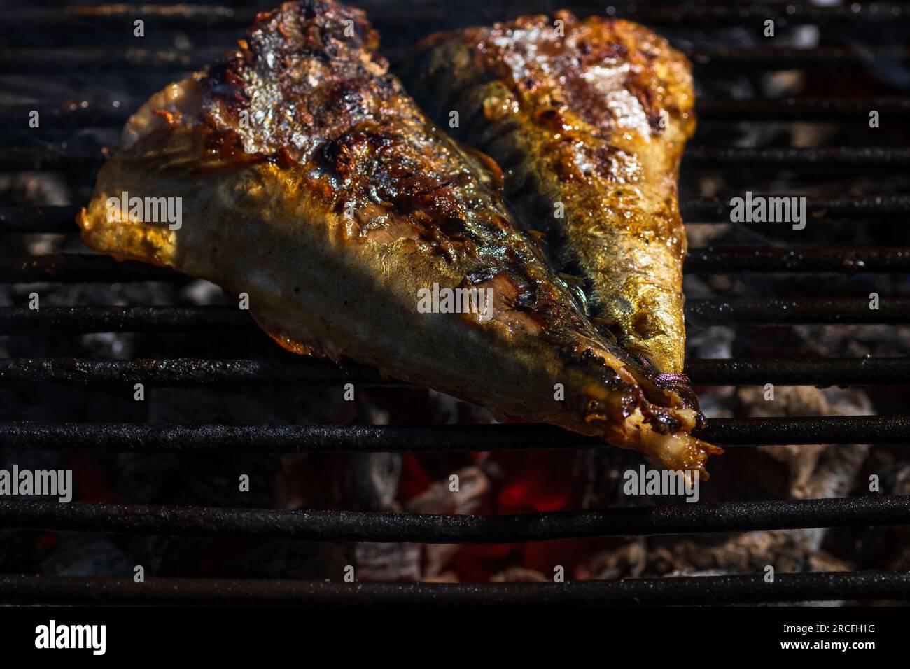 Grilled mackerel fish with smoke on a charcoal barbecue grill Stock Photo Alamy