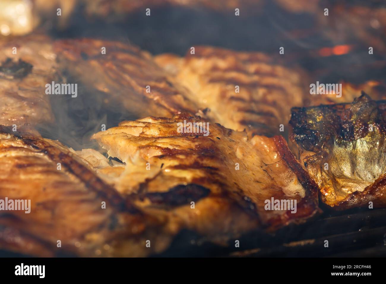 Grilled mackerel fish with smoke on a charcoal barbecue grill Stock Photo Alamy