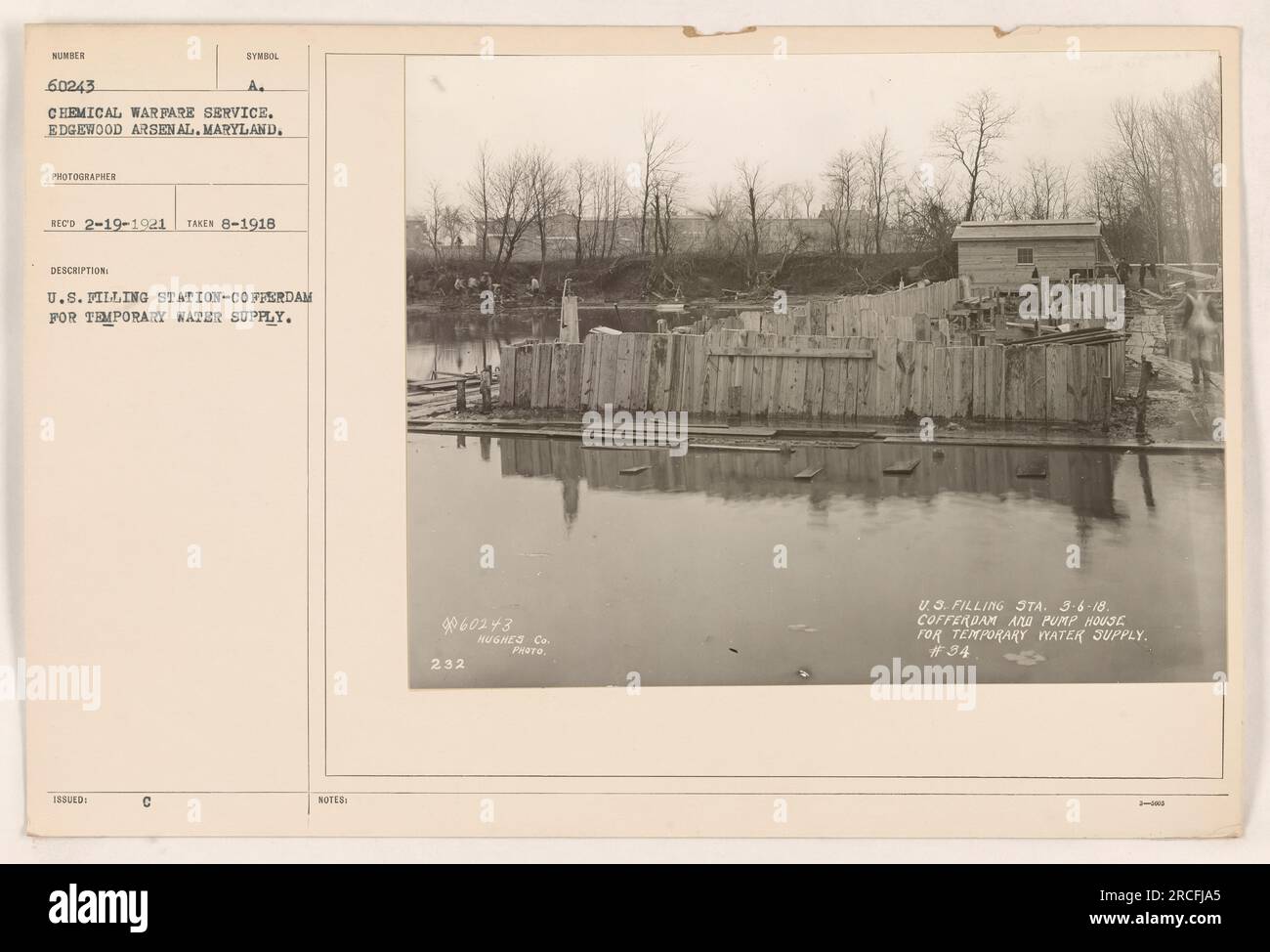 A U.S. filling station at Edgewood Arsenal, MD, operated by the Chemical Warfare Service during World War One. This image shows a cofferdam being constructed for a temporary water supply. The photograph was taken in August 1918 and received by the photographer on February 19, 1921. It was issued with notes 60243 and labeled as photograph number 232 by Hughes Co. Stock Photo
