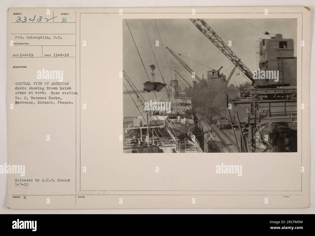 American soldiers unloading supplies from a ship at the Brown hoist ...