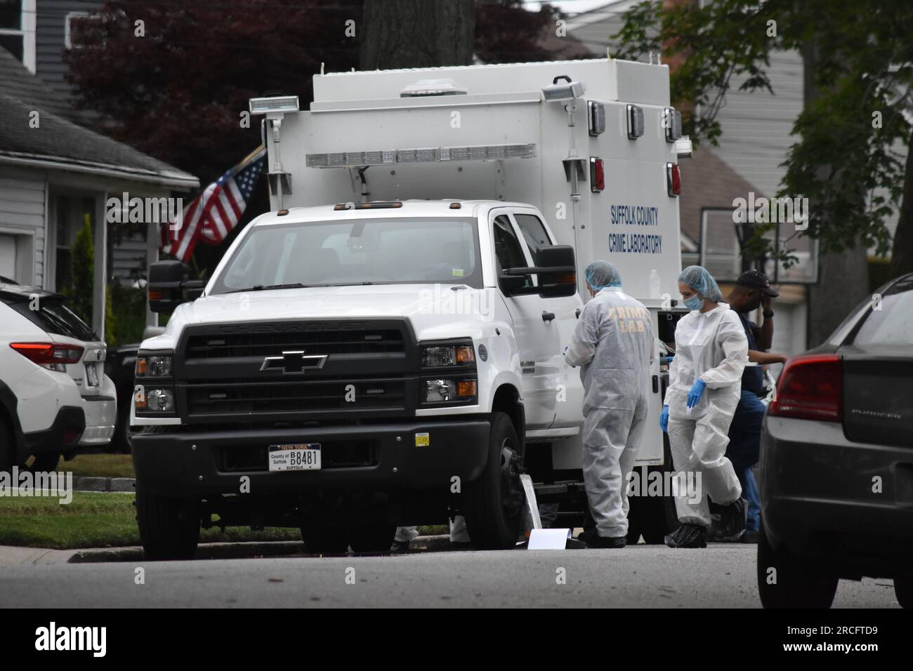 United States. 14th July, 2023. Numerous investigators at the crime scene. Crime scene investigators on scene as a suspect is arrested in Gilgo Beach serial killings In Massapequa Park, Long Island, New York on July 14, 2023. Massive police presence on First Avenue and Michigan Avenue as police apprehend the suspect involved in the Gilgo Beach serial killings. Credit: SOPA Images Limited/Alamy Live News Stock Photo