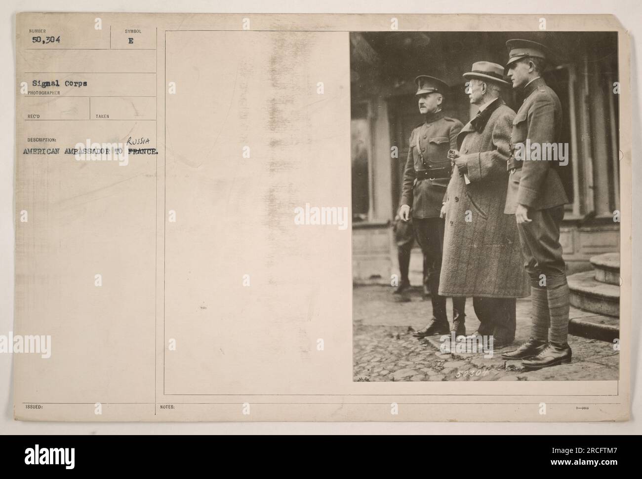 American Ambassador to Russia, David R. Francis, visits American troops during World War One. This photograph, taken by an official Signal Corps photographer, captures the ambassador engaging with soldiers in the field. The image is part of a larger collection showcasing American military activities during the war. Stock Photo