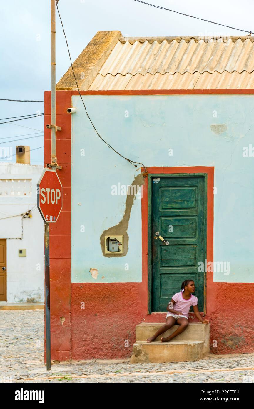 A Young African Girl Sitting Outside Her House, Boa Vista, Cape Verde, Africa Stock Photo