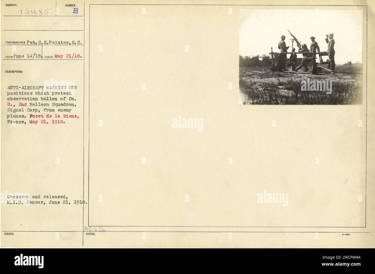 American soldier stands guard at an anti-aircraft machine gun position in the Foret de la Riene in France, May 21, 1918. This position protects the observation balloon of Co. B., 2nd Balloon Squadron, Signal Corps from enemy planes. Photograph taken by Pvt. C. E. Painter, S. C. TEC-June 14/18. Released by M.I.B. Censor, June 21, 1918. Stock Photo