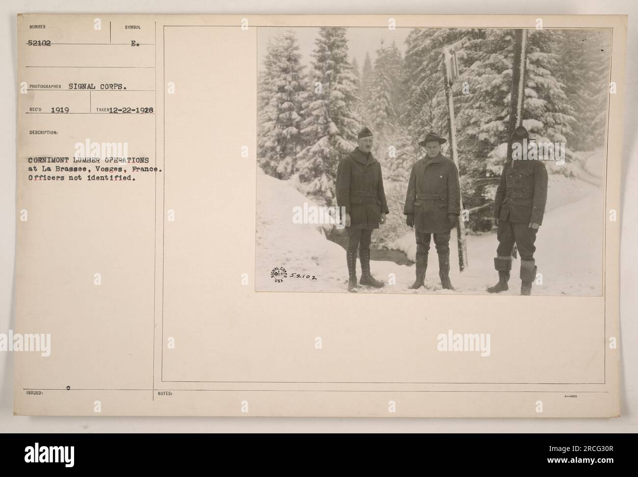 Photograph of Cornimont lumber operations at La Brasse, Vosges, France during World War One. The officers in the image are not identified. This is photo number 52102 taken by Signal Corps photographer Reed in 1919. The description symbol issued is B. The photograph was taken on December 22, 1928. Additional notes state that the lumber operations took place at La Brassee. Stock Photo