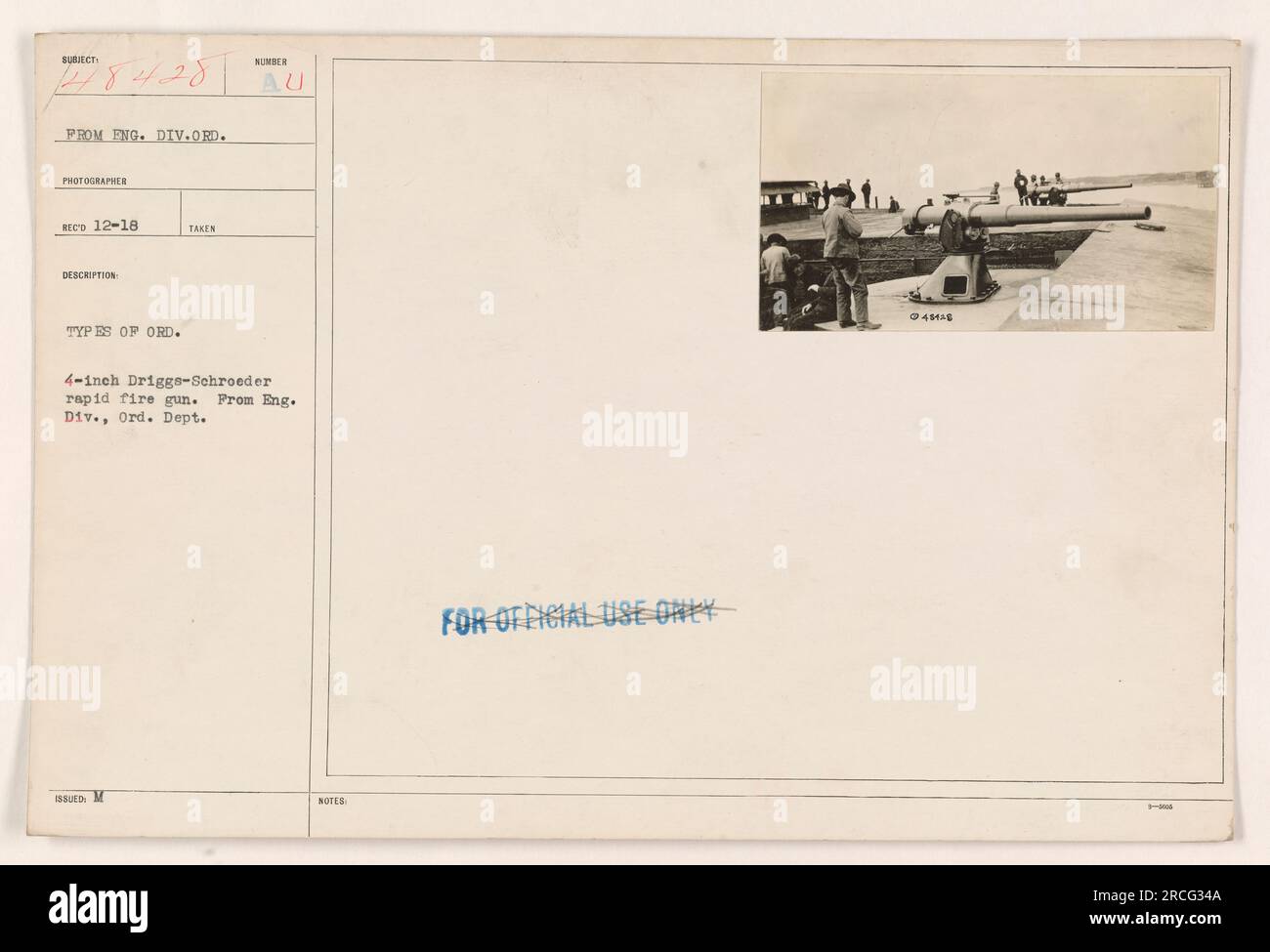 Image showing a 4-inch Driggs-Schroeder rapid fire gun types from the Engineering Division, Ordinance Department. The photograph is labeled as PROM FNG. DIV. ORD. PHOTOGRAPHER REED 12-18. Official use notes indicate the gun model as AU and its identification number as IBU M NUMBER. Stock Photo