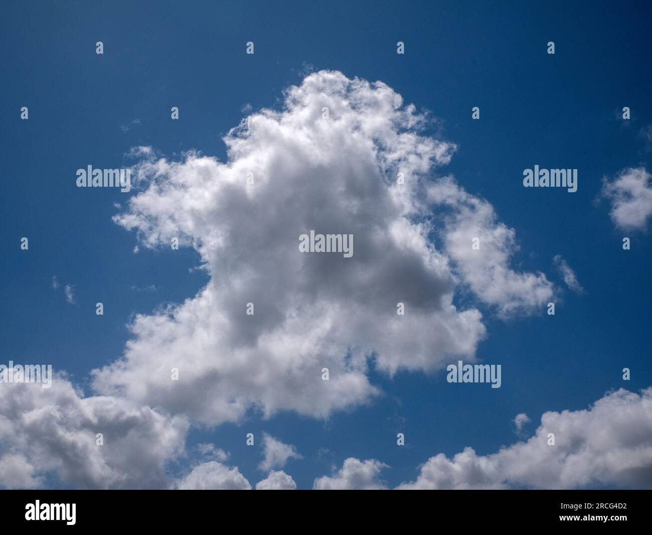 White fluffy clouds in the deep blue sky background Stock Photo - Alamy