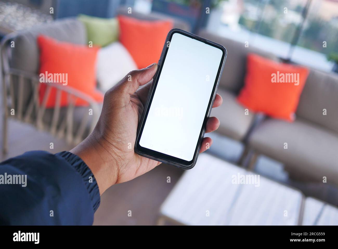 young man hand using smart phone with green screen at cafe Stock Photo ...