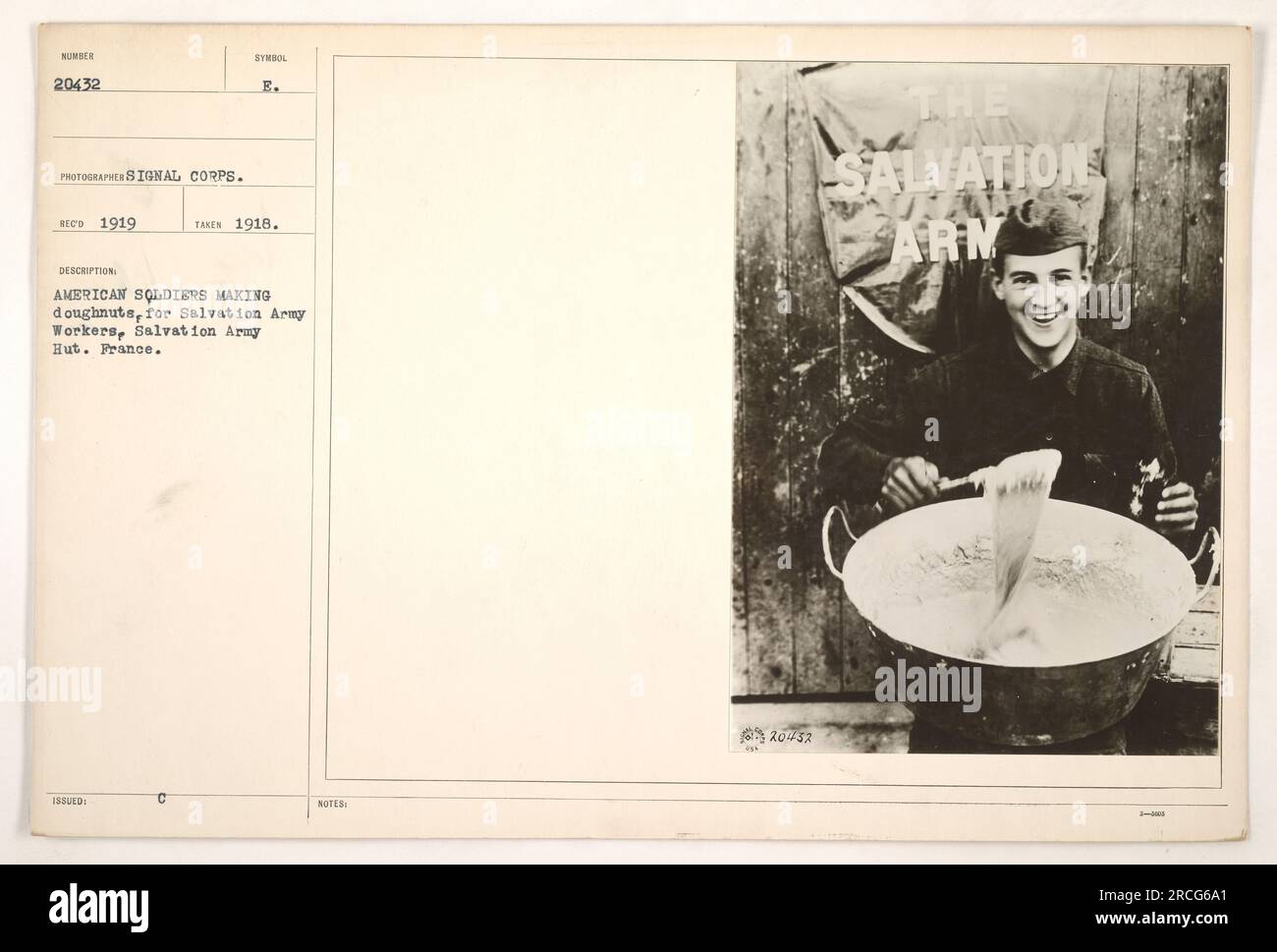 American soldiers in France making doughnuts for Salvation Army workers at a Salvation Army Hut in 1918. This photograph, taken by the Signal Corps photographer in 1919, captures the American military's assistance to the Salvation Army during World War One. Technical details: 111-SC-20432, symbol issued E, notes referencing Salvation Army 1-0006. Stock Photo