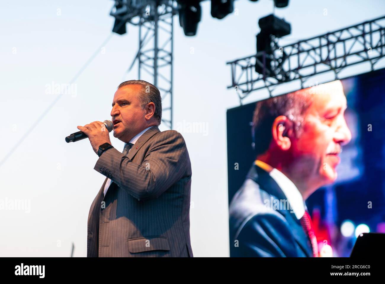 July 14, 2023, Uskudar, Istanbul, Turkey: On the 7th anniversary of the coup attempt organized by FETO (Fetullah Terrorist Organization) on July 15, 2016, Osman Askin Bak (L), Minister of Youth and Sports of the Republic of Turkey gives a speech at the commemoration concert held, with the picture of President of Turkey of Rebuplic Recep Tayyip Erdogan (R) reflected on the screen in the background, in Istanbul to commemorate the national unity against the coup attempt, on July 15, is celebrated as Democracy and National Unity Day of Turkey. (Credit Image: © Tolga Uluturk/ZUMA Press Wire) EDITOR Stock Photo