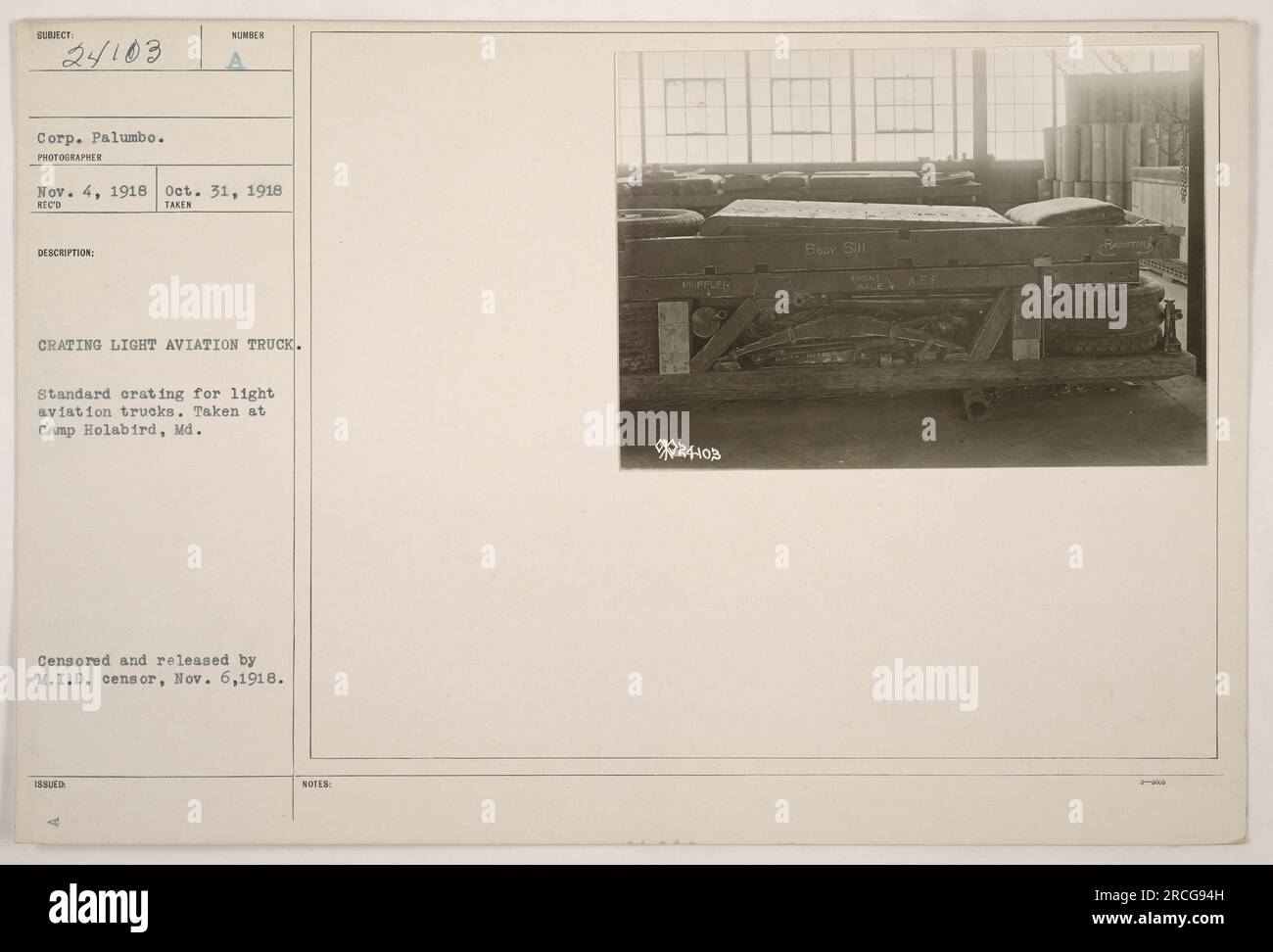 Corporal Palumbo crating a light aviation truck at Camp Holabird, Maryland. This standard orating process was captured on October 31, 1918, and the photo was cleared by the M.I.D. censor on November 6, 1918. (Note: The caption ends abruptly here, and additional information about 'Bear Sill' and 'ISSUED NOTES MIPPLER 20' is not available.) Stock Photo