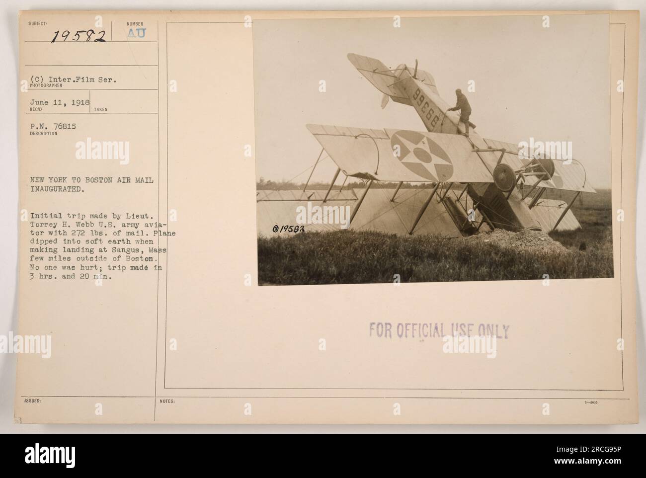 Lieutenant Torrey H. Webb, a U.S. army aviator, inaugurates the New York to Boston air mail service on June 11, 1918. During the initial flight, the plane carrying 272 lbs. of mail briefly got stuck in soft earth while landing in Sangus, Massachusetts, just outside of Boston. Nobody was injured, and the entire trip took 3 hours and 20 minutes. (Official use only: 19583 89366) Stock Photo