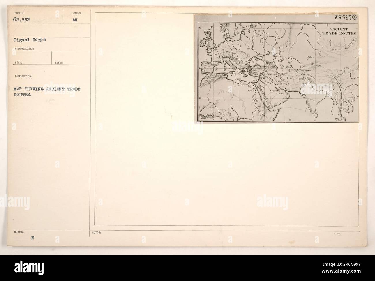 Photograph of a map showing ancient trade routes, taken by the Signal Corps during World War One. This map, numbered 62,552, was issued as part of the photographer's records. The map highlights different trade routes from ancient times. A symbol, labeled H, with attendant notes, labeled Al compite 899890, can be seen on the map. Stock Photo