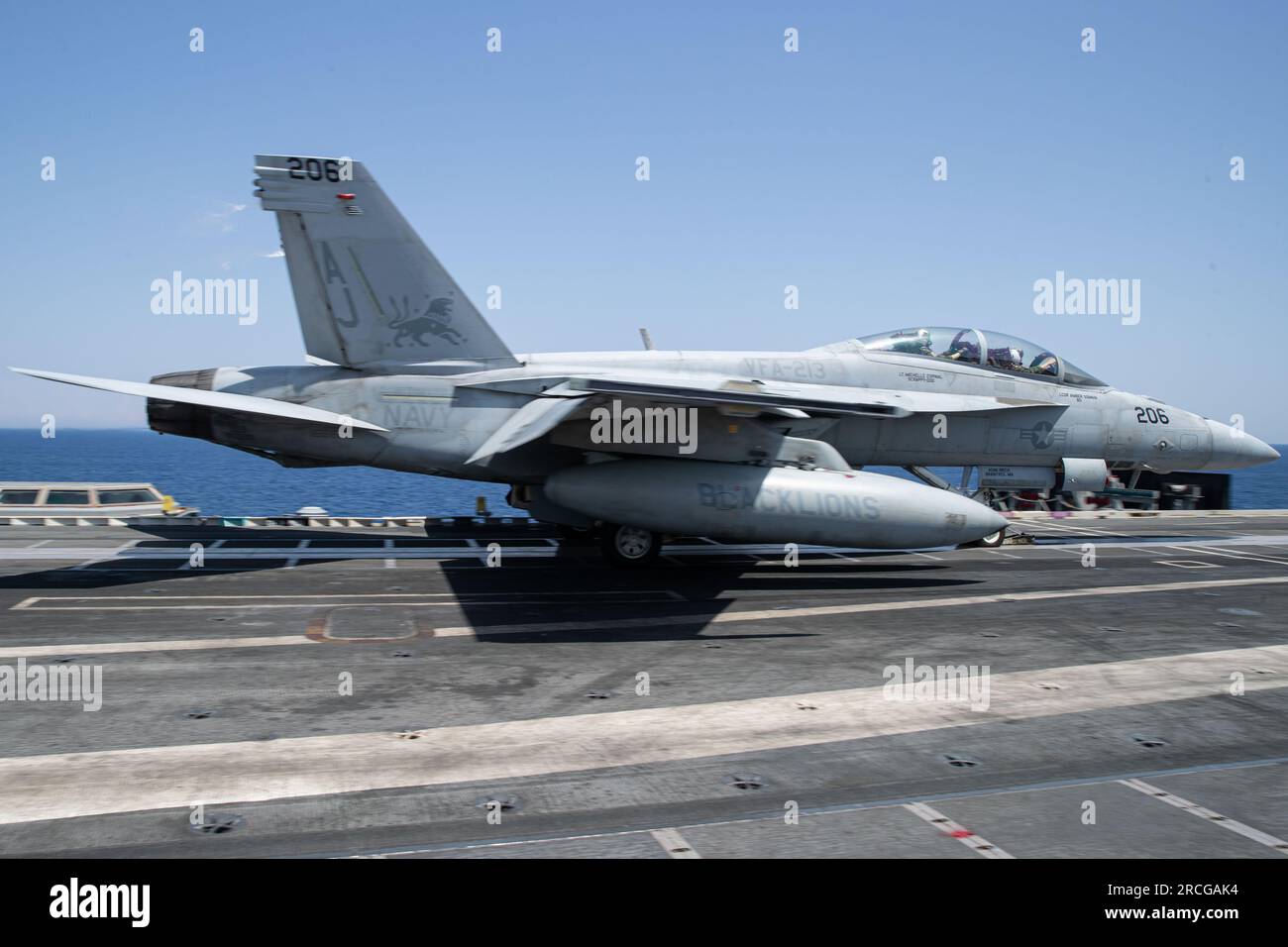 Capt. Dan Catlin, right, commanding officer of Carrier Air Wing (CVW) 8 ...