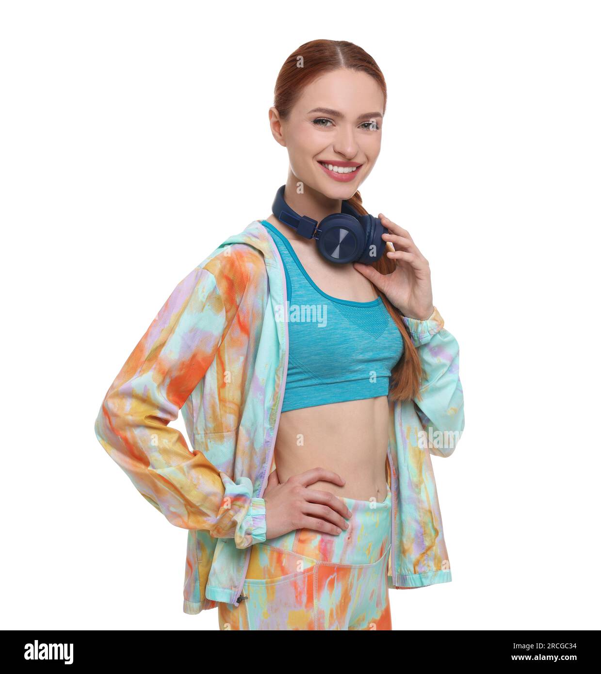 Young woman in sportswear and headphones on white background Stock ...