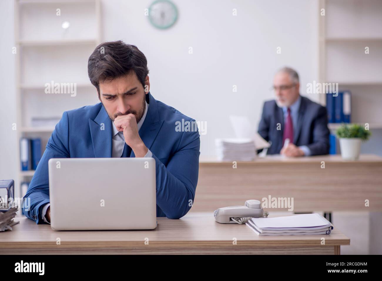 Two colleagues working at workplace Stock Photo