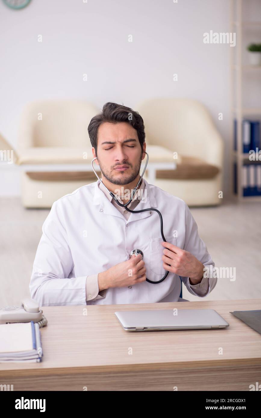 Young male doctor working at the hospital Stock Photo