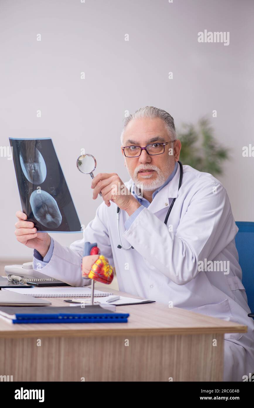 Old doctor radiologist working at the hospital Stock Photo - Alamy