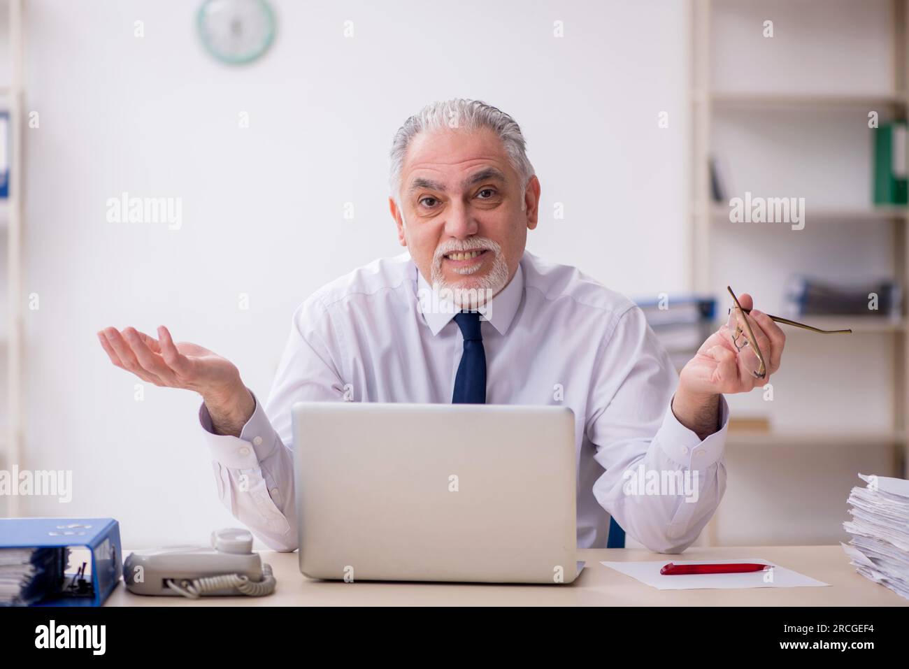 Old boss employee working at workplace Stock Photo - Alamy