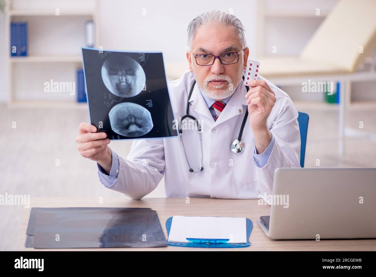 Old doctor radiologist working at the hospital Stock Photo - Alamy