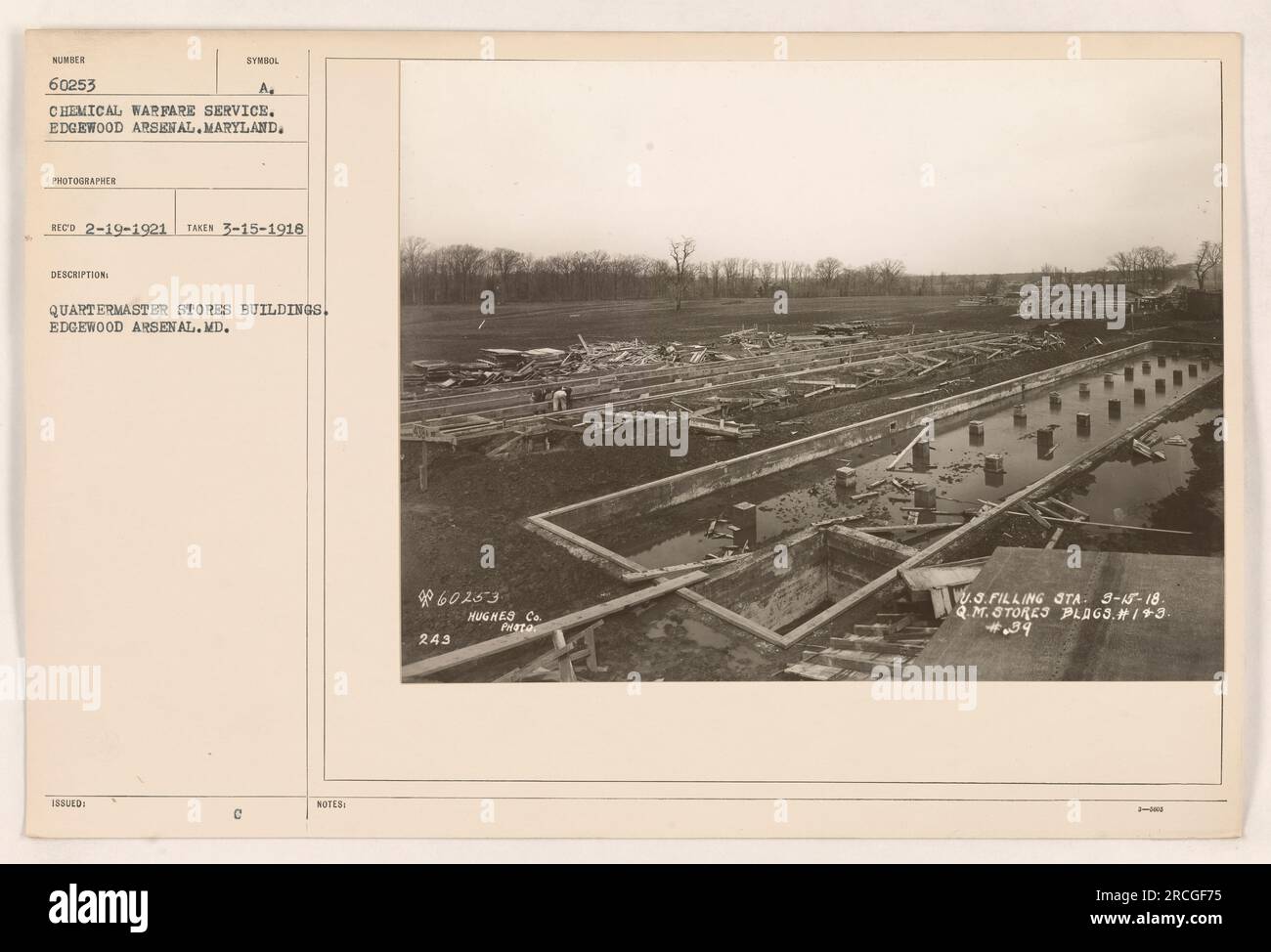 Quartermaster stores buildings at Edgewood Arsenal, MD, were captured in this photograph taken on March 15th, 1918. The image is numbered 60253 and shows buildings utilized by the Chemical Warfare Service. Photographer's symbol: RECO 2-19-1921. Additionally, there are notes mentioning the presence of Hughes Co Prata U.S. Filling Sta. Stock Photo