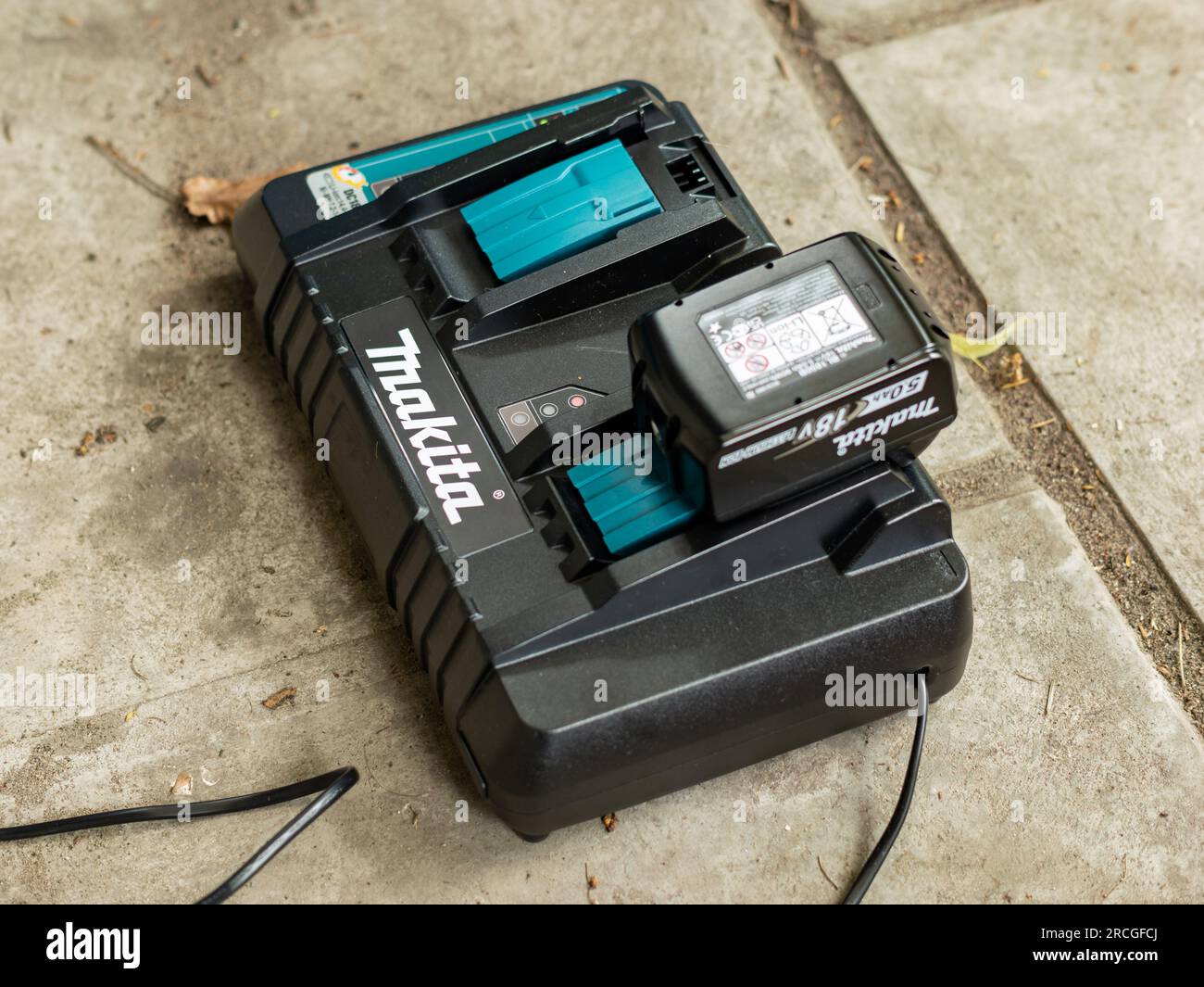 Makita brand logo on the battery charger DC18RD. Japanese hardware brand  for gardening equipment and other professional tools. One battery is  charging Stock Photo - Alamy