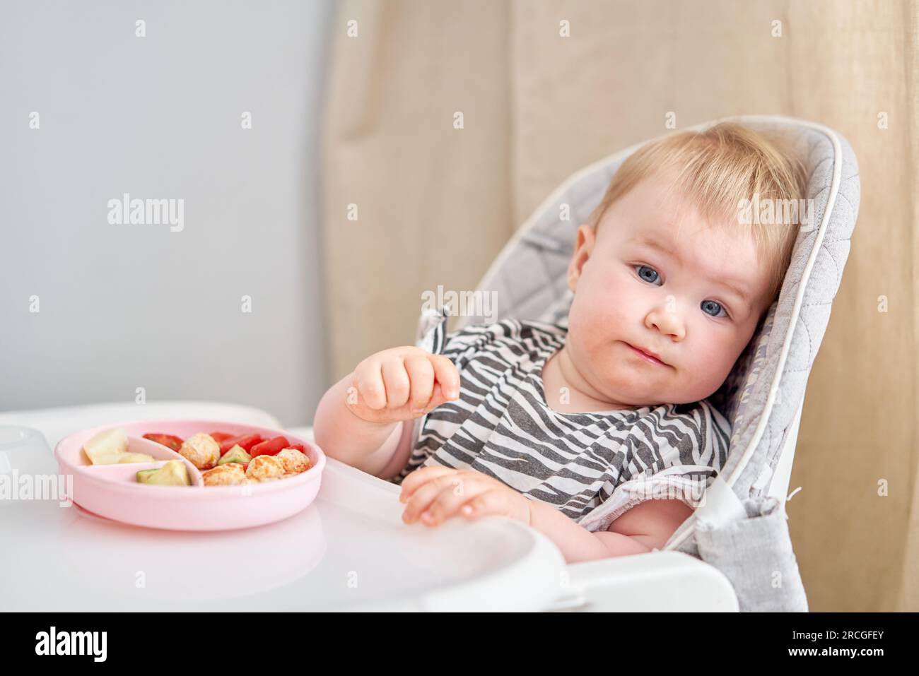 baby girl eating meat 