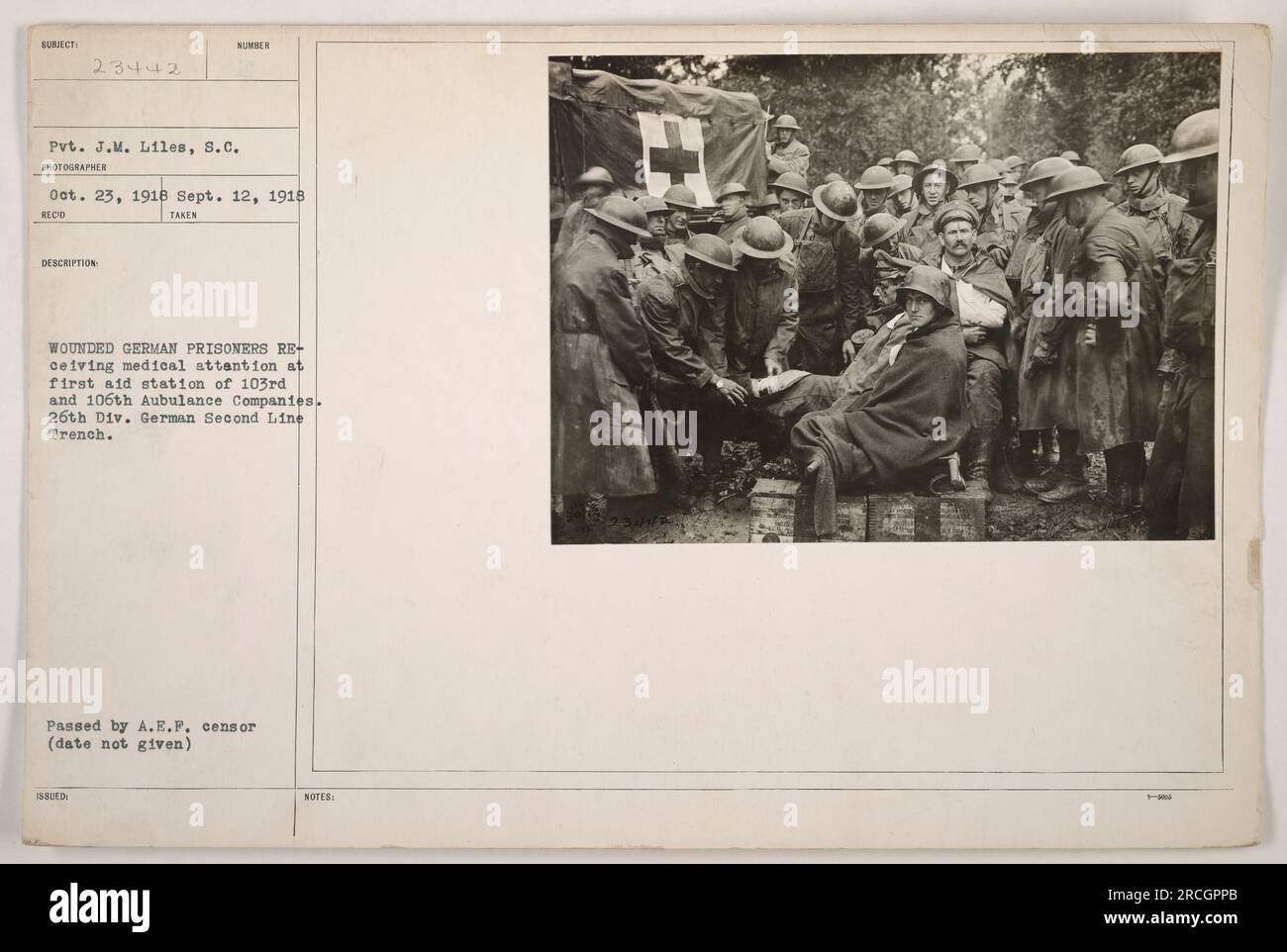 'Wounded German prisoners receiving medical attention at a first aid station of the 103rd and 106th Ambulance Companies, located at St. Mihiel during World War One. The photograph, taken by Pvt. J.M. Liles of the Signal Corps on October 23, 1918, shows the German second line trench. It was taken as part of American military activities in the area. The image was later approved by the A.E.F. censor.' Stock Photo