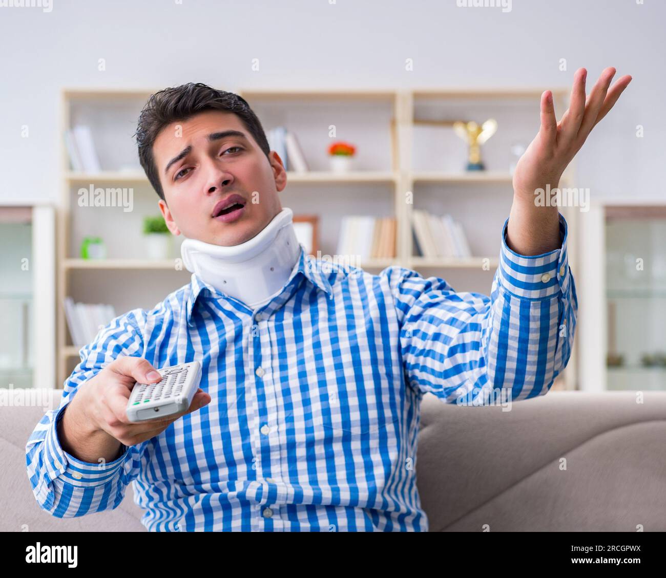 Man with a head neck spine trauma wearing a neck brace cervical collar