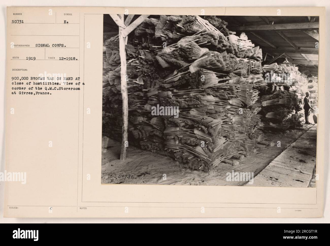 A view of a corner of the Q.M.C. Storeroom at Givres, France. In December 1918, at the close of hostilities, there were 900,000 brooms in the storeroom. This photograph was taken by E. Eco in 1919 and is part of the NUMOTE 50731 collection of the Signal Corps. Stock Photo