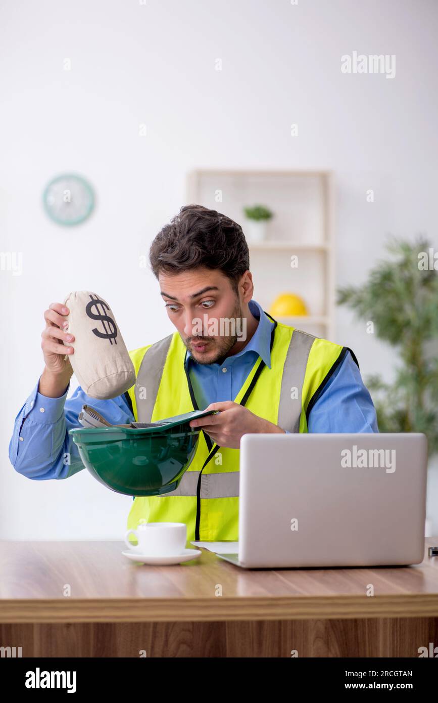 Young architect in remuneration concept Stock Photo