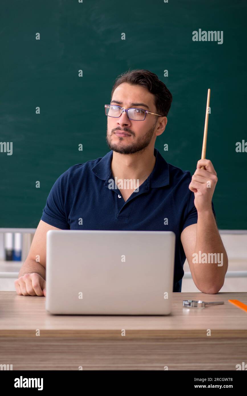 Young teacher in telestudying concept Stock Photo