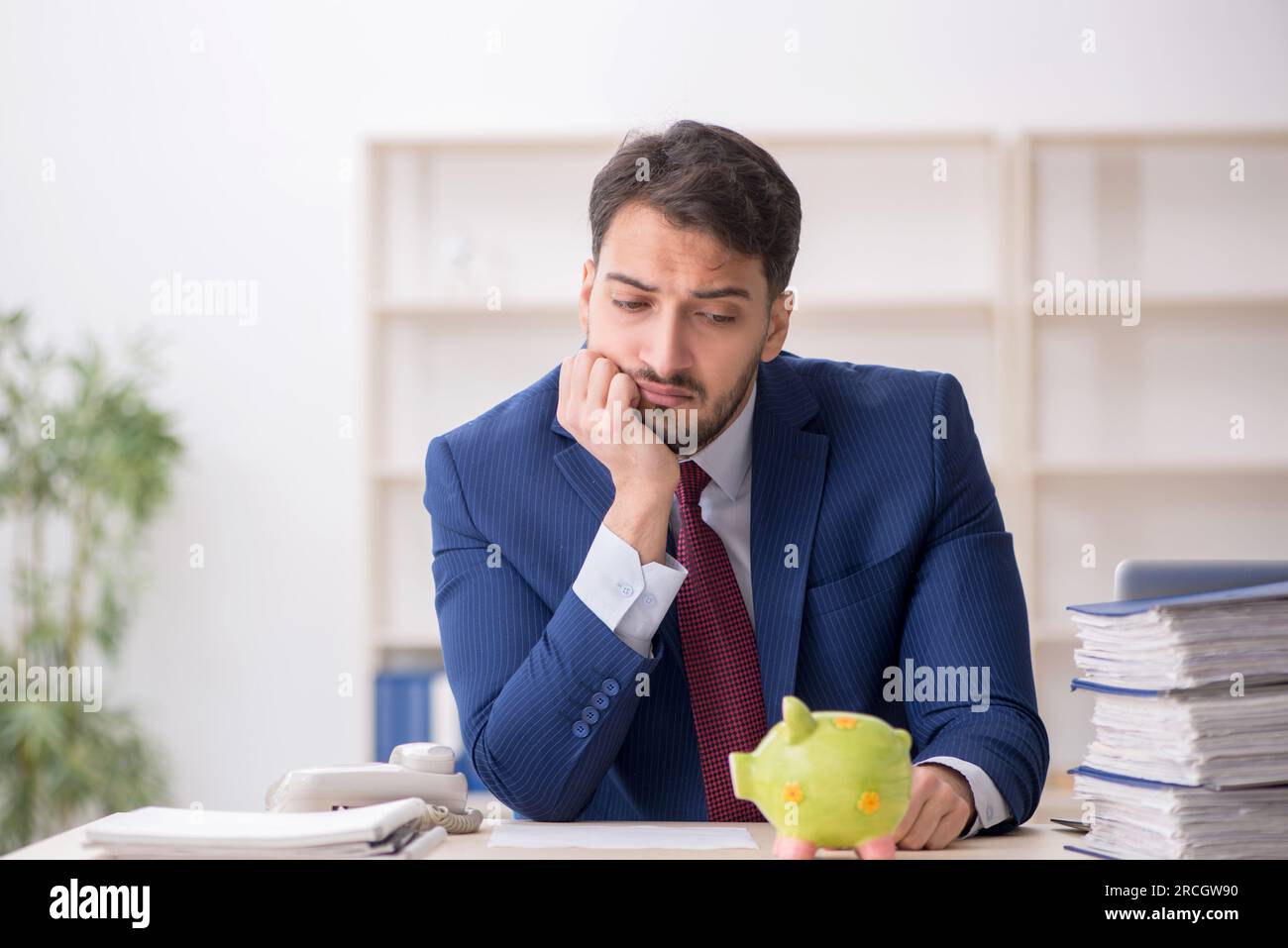 Young employee in planning retirement concept Stock Photo